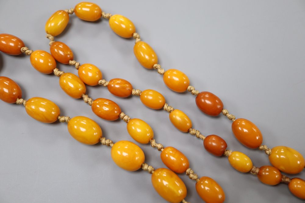 A single strand graduated oval amber bead necklace, 84cm, gross 40 grams.